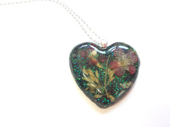 Pressed flower and sparkle resin heart with sterling silver bail and chain