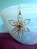 Freeform flower with blue spinel centre