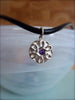 Celtic circle with purple cubic zirconia accent