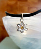 Miniature flower with yellow cubic zirconia accent