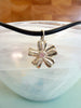 Flower with pink cubic zirconia accent